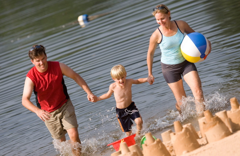 Family on the beach at Wintergreen Resort.