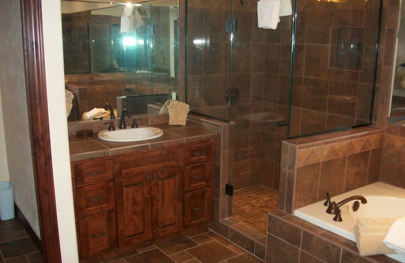 Rental bathroom with hot tub at Sunetha Property Management.