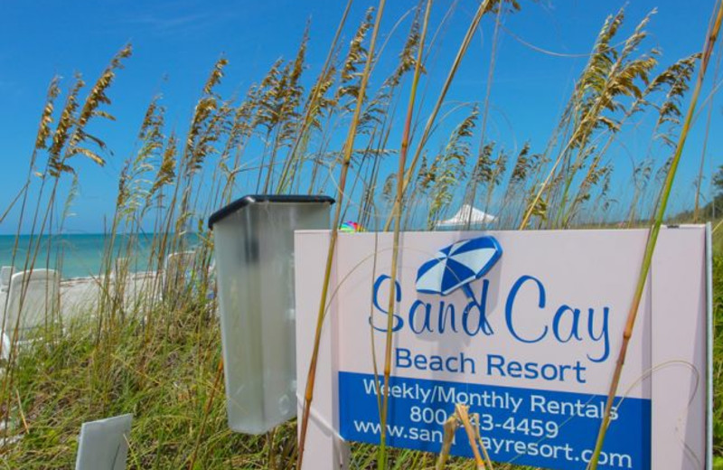 Sand Cay Beach Resort sign.