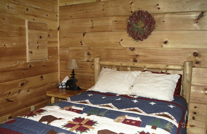 Cabin bedroom at Big Bear Log Cabins.