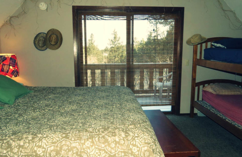 Cabin bedroom at Edelweiss Mountain Lodging.