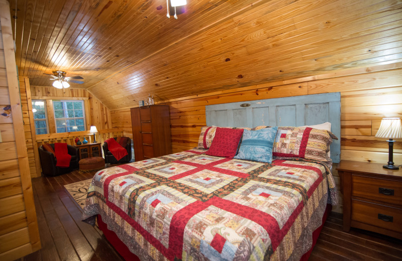 Cabin bedroom at Kiamichi Country Cabins.