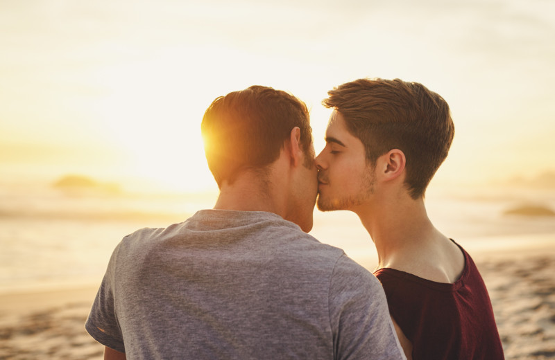 Couple kissing on beach at Harbor Hotel Provincetown.