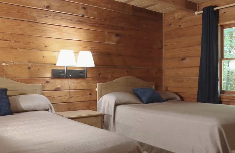 Cabin bedroom at Eddy Creek Marina Resort.