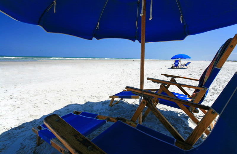 Relax on the beach at Holiday Isle Oceanfront Resort.