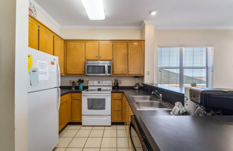 Rental kitchen at Beachfront Rentals and Sales.