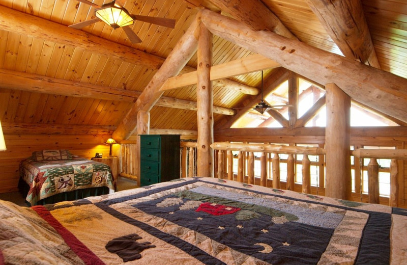 Cabin bedroom at Trout House Village Resort.