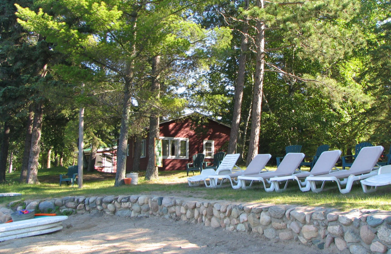 Lounge chairs by the beach at Two Inlets Resort.