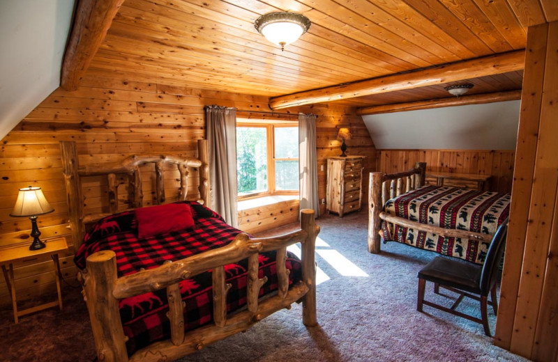 Cabin bedroom at Clearwater Historic Lodge & Canoe Outfitters.