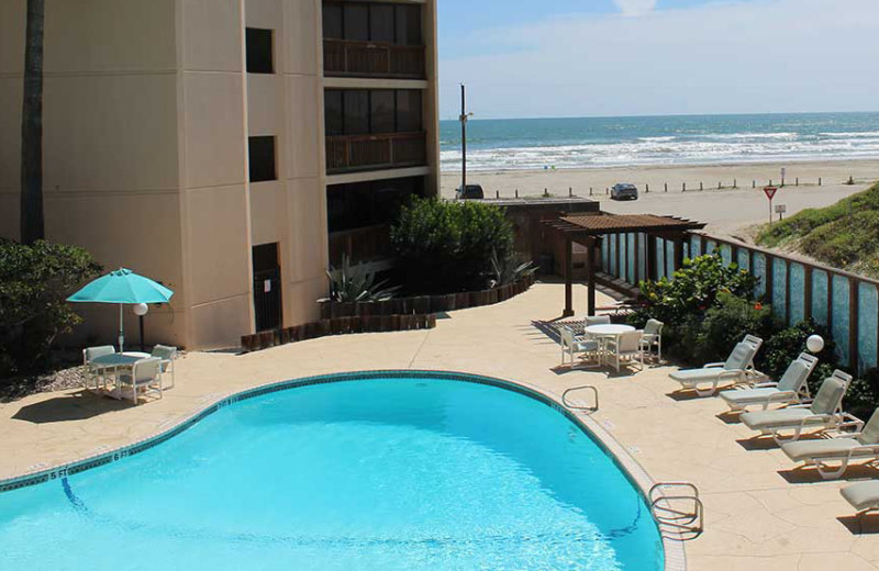 Outdoor pool at The Dunes Condominiums.