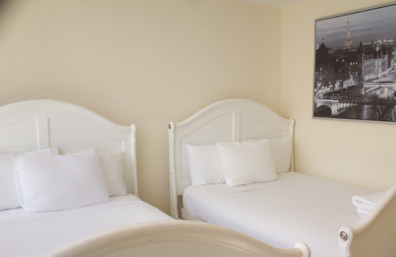 Guest bedroom at The Alexander All Suite Oceanfront Resort.