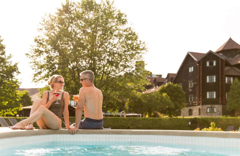 Couple by the pool at Fairmont Le Chateau Montebello.