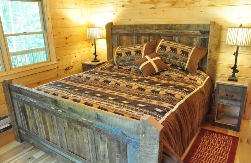 Cabin bedroom at Great Smokys Cabin Rentals.