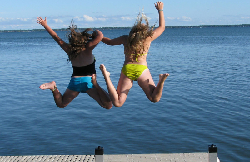 Jumping in the lake at Ottertail Beach Resort.