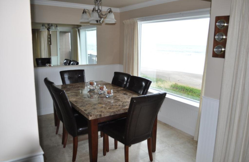 Unit 21 dining room at Cavalier Beachfront Condominiums.