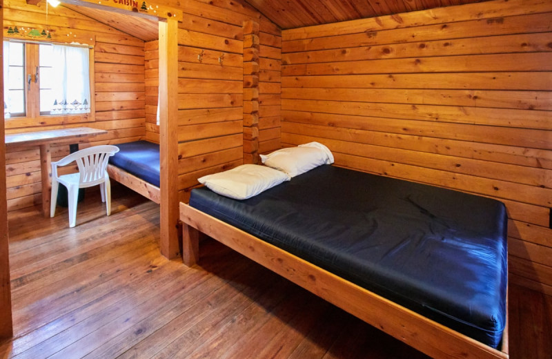 Cabin bedroom at Yogi Bear's Jellystone Park Warrens.