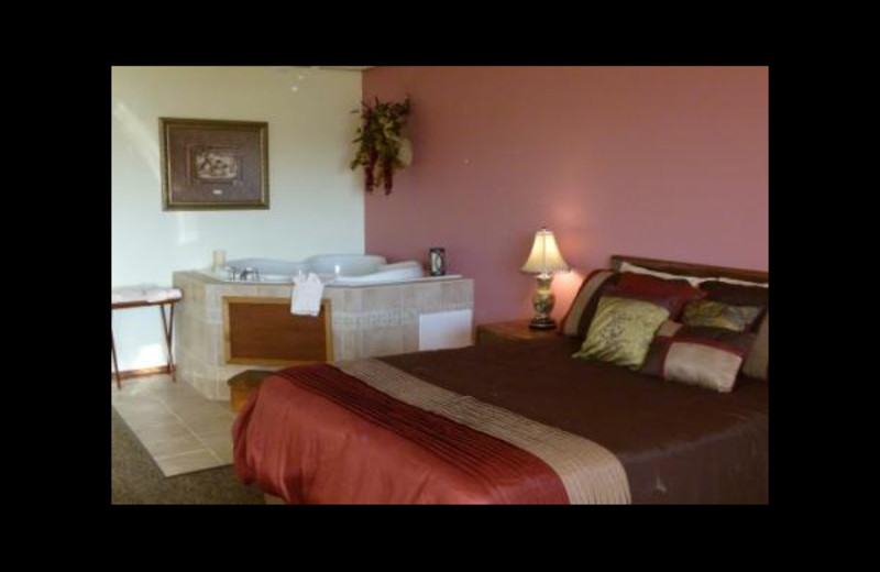 Jacuzzi guest room at Pointe West Resort & Suites.