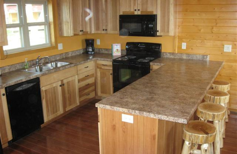 Sunrise Ridge Cabin Kitchen has full size appliances and stocked with all kitchen essentials.