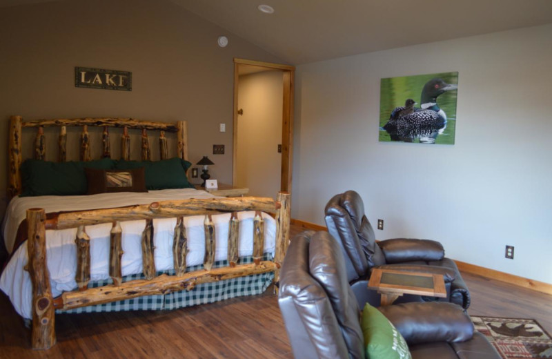 Cabin bedroom at Summit Lake Lodge.