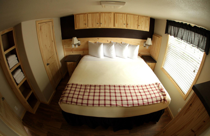 Cottage bedroom at Hill Country RV Resort & Cottage Rentals.