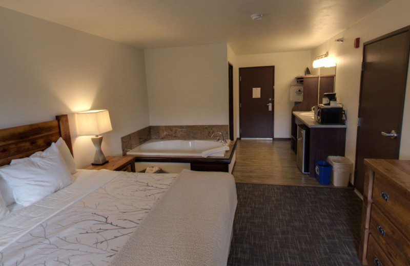 Guest room with hot tub at Open Hearth Lodge.