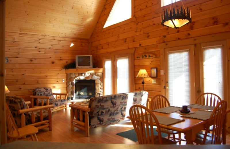 Cabin living room and dining table at Warrens Lodging.