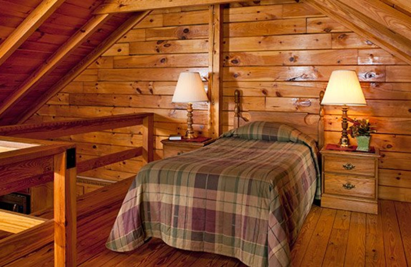 Cabin loft bedroom at Smoke Hole Caverns & Log Cabin Resort.