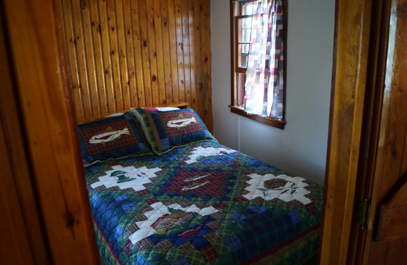 Cabin bedroom at Anderson's Starlight Bay Resort.