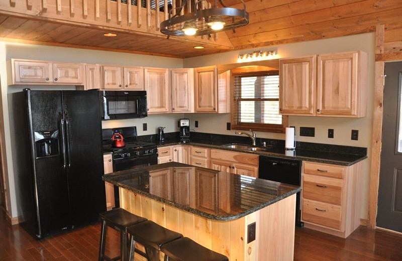 Cabin kitchen at Great Smokys Cabin Rentals.