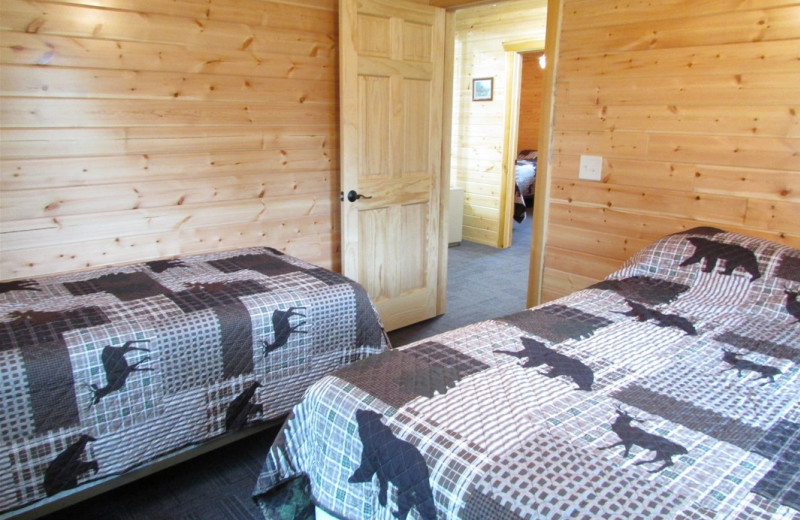 Cabin bedroom at Pine Aire Resort.