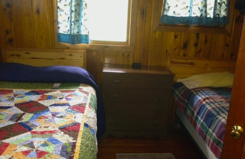 Cabin bedroom at Sandy Point Lodge.