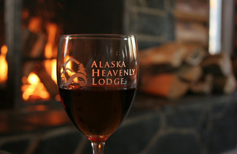 Wine in front of the fireplace Alaska Heavenly Lodge.