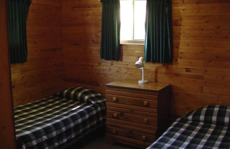 Cabin bedroom at Pipestone Point Resort.