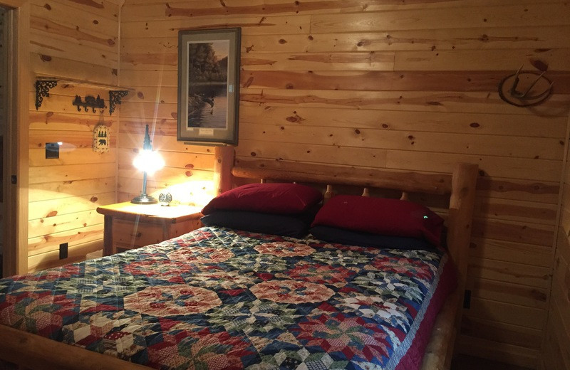 Cabin bedroom at Black Lantern Resort and Retreat.