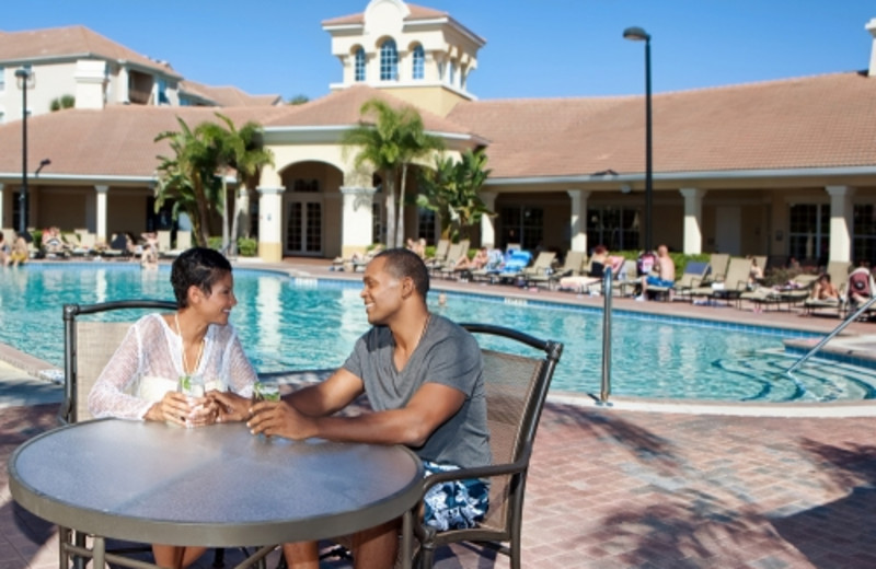Couple by pool at Vista Cay Resort.