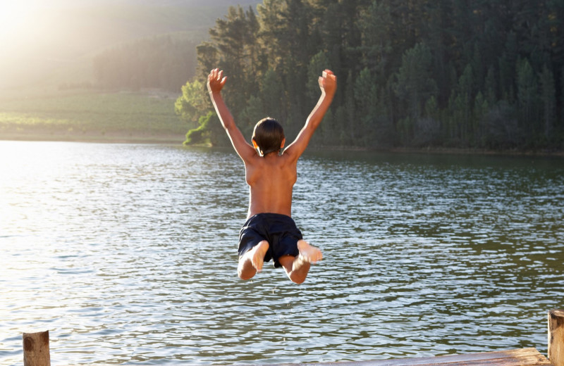 Jumping in lake at Nitschke's Northern Resort.