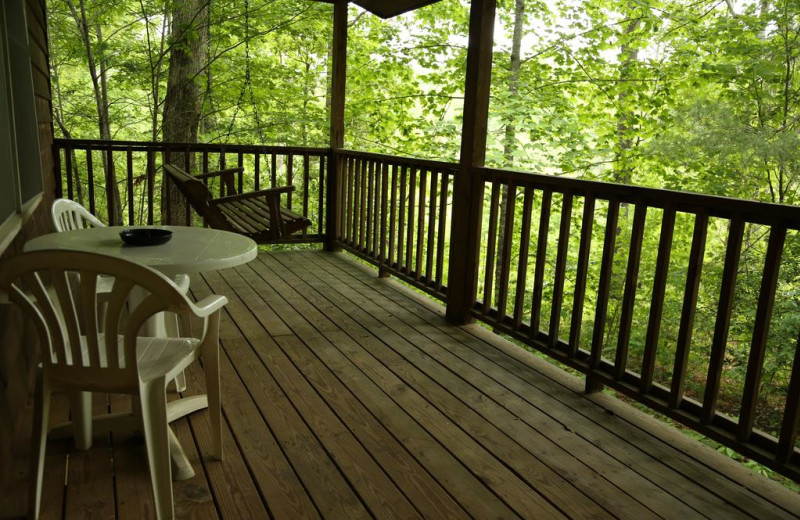 Covered porch w/swing on one of our Cupid's Hideout Cabins.