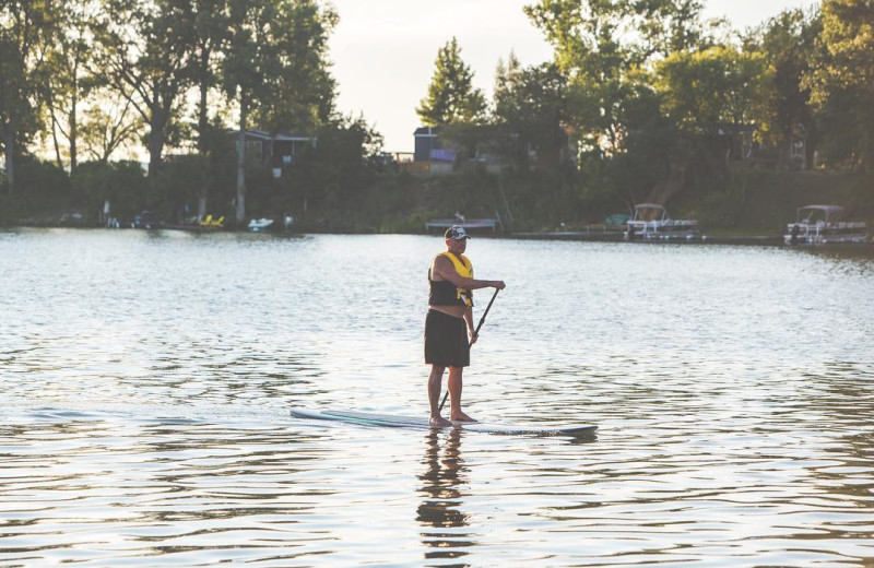 Paddle board at Great Blue Resorts- Cherry Beach Resort.