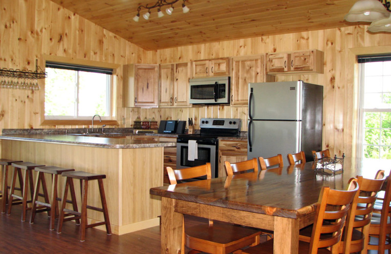 Cottage kitchen and dining table at Angel Rock Waterfront Cottages.