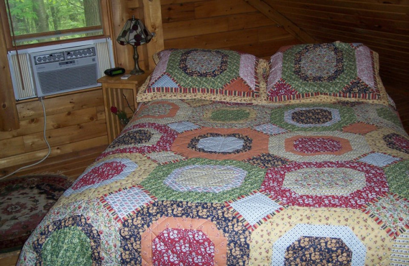 Cabin bedroom at Sunset Ridge Log Cabins.