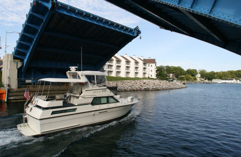 Boat passing into the harbor at Edgewater Inn on the Harbor.