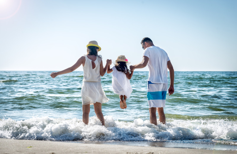 Family on beach at Destinique.