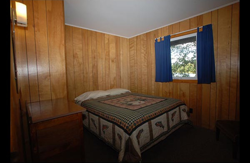 Cabin bedroom at Isle O' Dreams Lodge.
