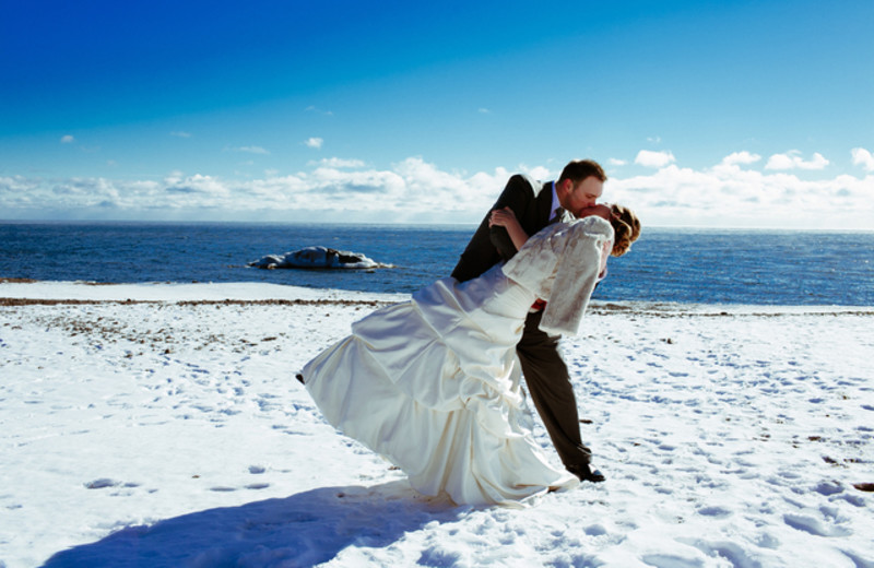 Wedding couple in snow at Lutsen Resort on Lake Superior.