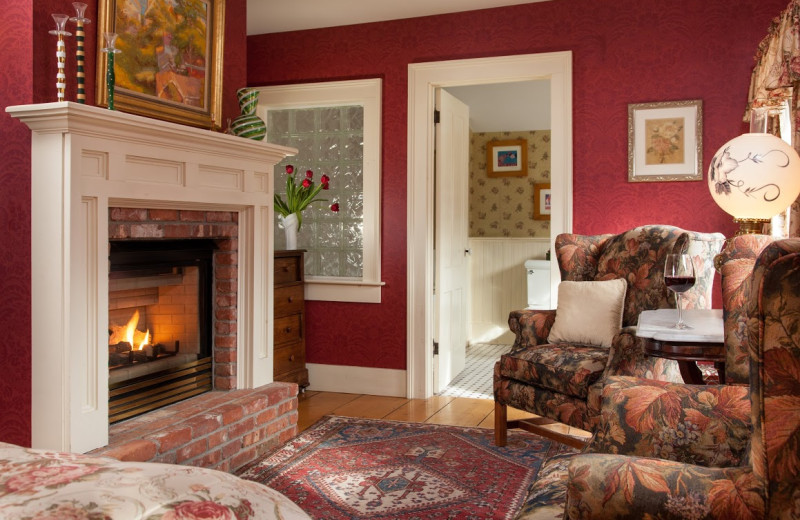 Guest room with fireplace at The Inn at Weston.