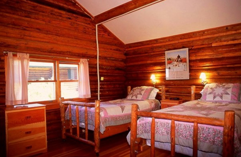 Cabin bedroom at Triangle X Ranch.