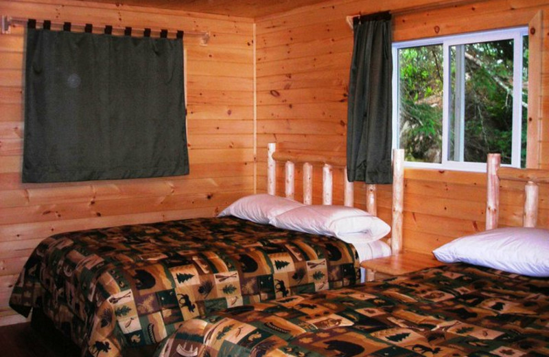 Cabin bedroom at Shady Roost Lodge.