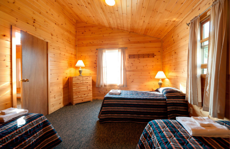 Cabin bedroom at Tetu Island Lodge.