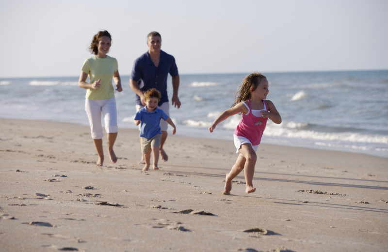 Family on beach at Old Town Inn.