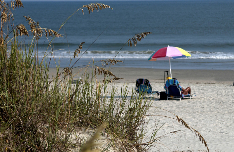 Relaxing on the beach at Ocean Isle Inn.